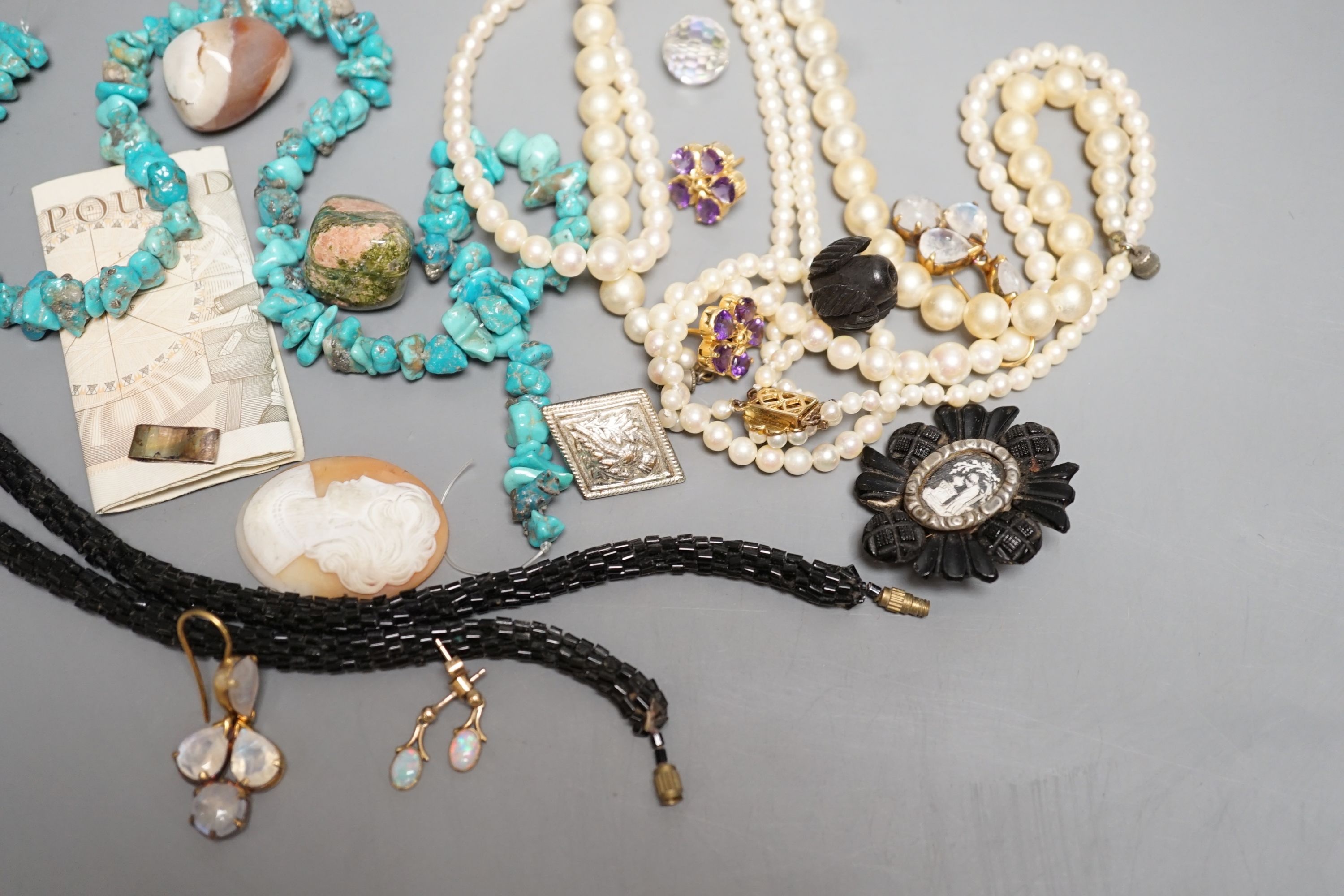 A quantity of costume jewellery including a pair of yellow metal and opal drop earrings.